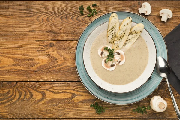 Mushroom soup with parsley on rustic wooden table — Stock Image Mushroom soup with parsley on rustic wooden table Stock Photo