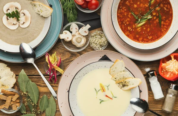 Three different soups on wooden table — Stock Image Three different soups on wooden table Stock Image
