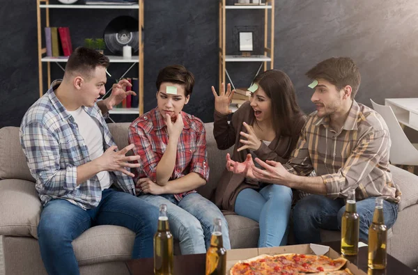 Young friends playing funny game who I am — Stock Photo, Image