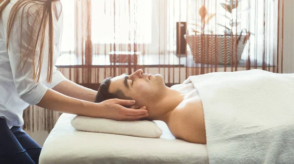 Handsome man getting professional massage