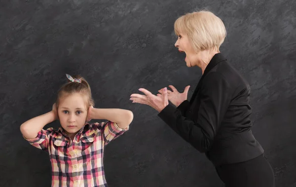 Grandmother arguing her little granddaughter — Stock Photo, Image