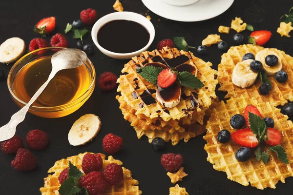 Waffles with berries and fruits, breakfast at black background — Stock Photo, Image