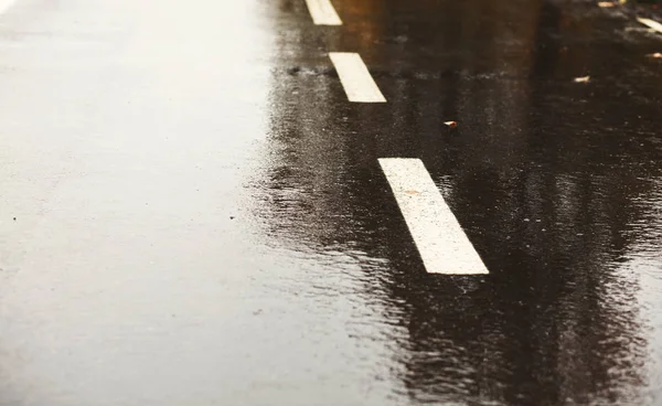 Dark grey asphalt road background wet after rain — Stock Photo, Image