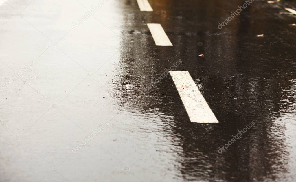 Dark grey asphalt road background wet after rain