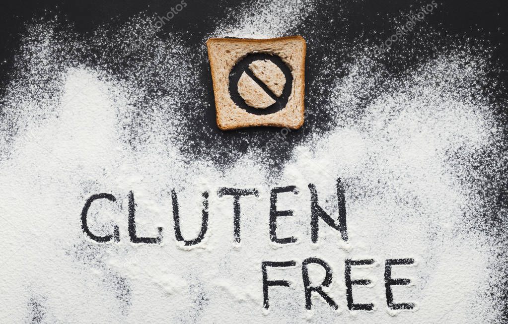 Gluten free inscription on scattered flour