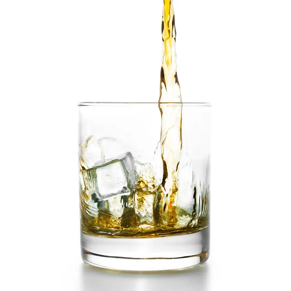 Golden whiskey pouring into lowball — Stock Photo, Image