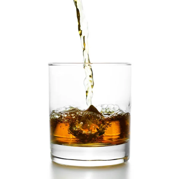 Golden whiskey pouring into lowball — Stock Photo, Image