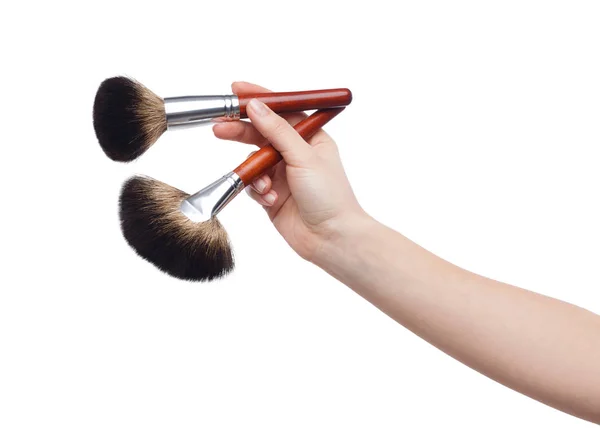 Professional make-up brushes in female hand isolated on white — Stock Photo, Image