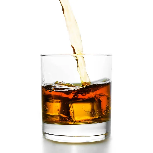 Golden whiskey pouring into lowball — Stock Photo, Image