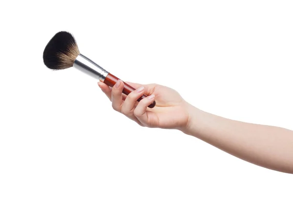 Cosmetic brush for makeup in female hand isolated on white — Stock Photo, Image