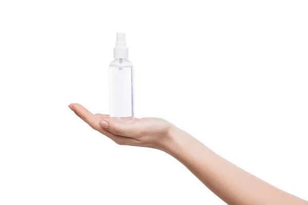 Vrouw hand met fles met thermaal water, geïsoleerd — Stockfoto