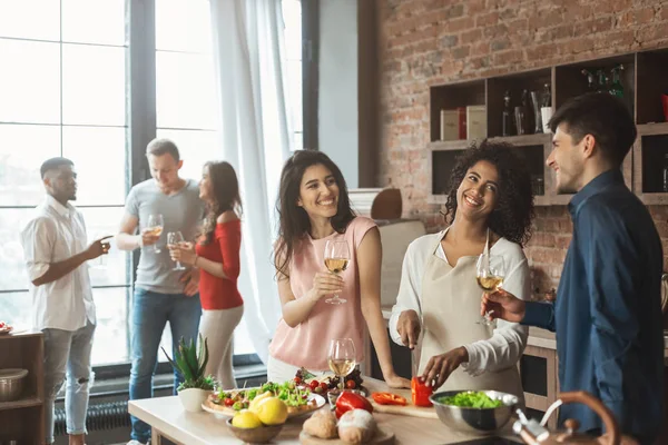 stock image Group of happy friends talking and drinking wine