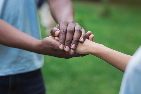 Close-up image of supporting hands of friend