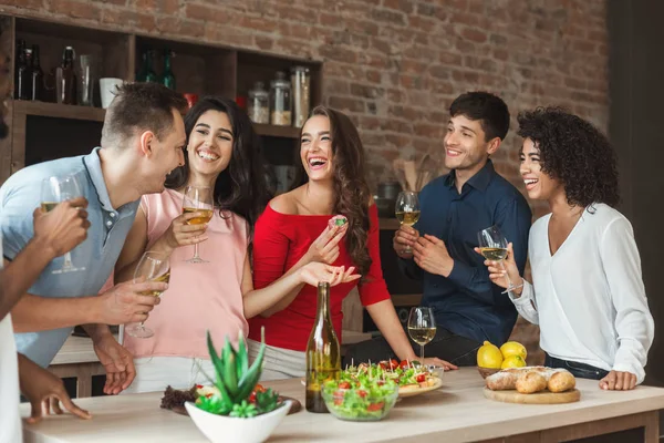 Multiracial friends enjoying small party at home — Stock Photo, Image