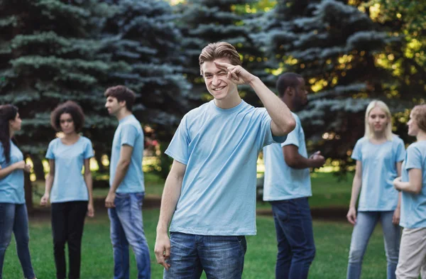 Meeting of young volunteers team in park — Stock Photo, Image