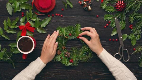 Top view of female hands making wreath — Stock Photo, Image