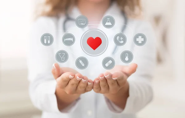 Doctor holding modern virtual screen interface with icons — Stock Photo, Image