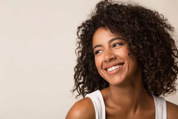 Beauty portrait of black woman on light background — Stock Photo, Image