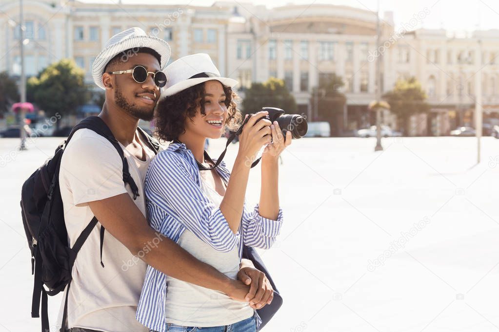 African-american couple exploring new city, copy space