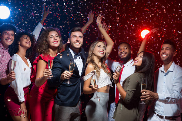 Happy diverse friends celebrating New Year together