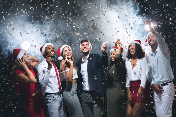 Group of joyful young people celebrating New Year together — Stock Photo, Image