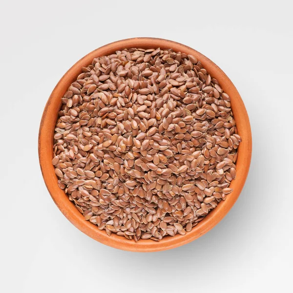 Bio organic flax seeds in ceramic bowl on grey — Stock Photo, Image