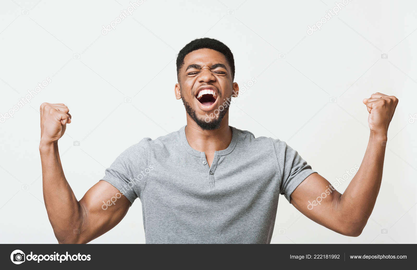 Black Man Screaming Yes And Raising Clenched Fists In The Air
