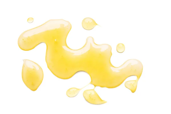 Mancha de mel doce isolado no fundo branco — Fotografia de Stock