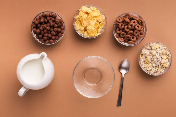 Various careals for breakfast in glass bowls, top view — Stock Photo, Image