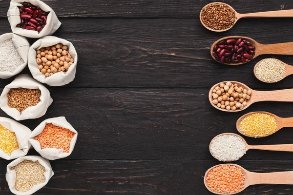 Various grains in cloth bags and spoons — Stock Photo, Image