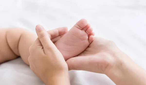 Little baby foot in mother hands closeup — Stock Photo, Image