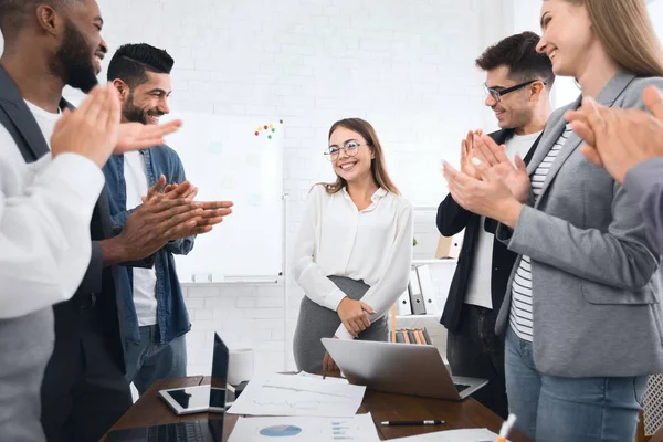 Business team congratulating successful female manager with applause — Stock Photo, Image