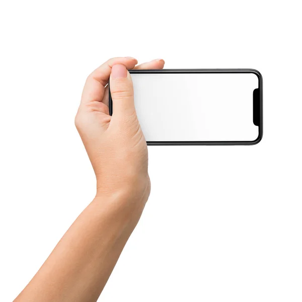 Hand hält Mobiltelefon in horizontaler Position für Attrappe — Stockfoto