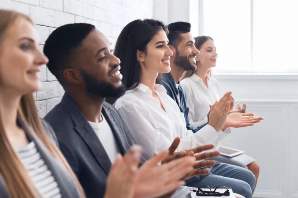 Group of businesspeople clapping hands at meeting — Stock Photo, Image