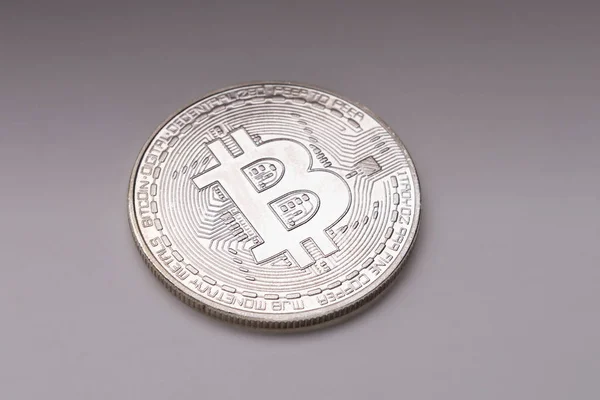 Physical silver BTC coin on gray background — Stock Photo, Image