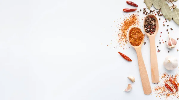 Seasoning background with dry spices in spoon