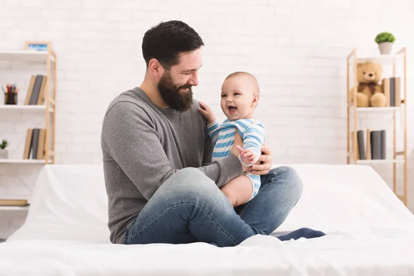 Happy father playing with little baby boy at home — Stock Photo, Image