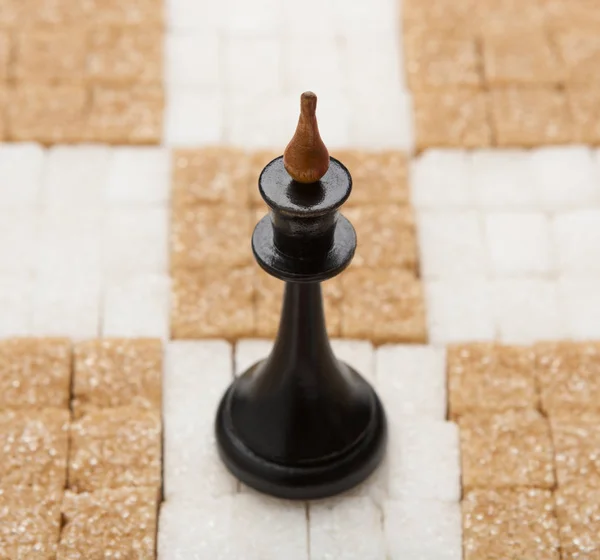 Chess board made of white and brown sugar with King — Stock Photo, Image