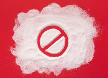 Stop prohibition sign on white sugar background clipart