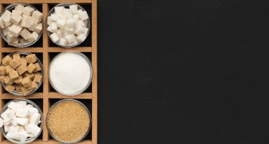 Various types of sugar on black background. clipart
