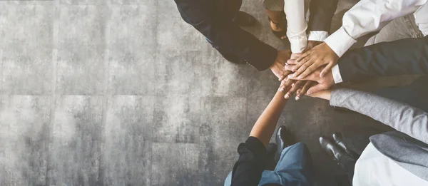 Business people putting their hands together, top view — Stock Photo, Image