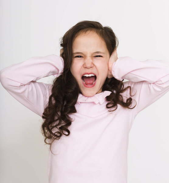 Brunette girl screaming. Frustration concept.