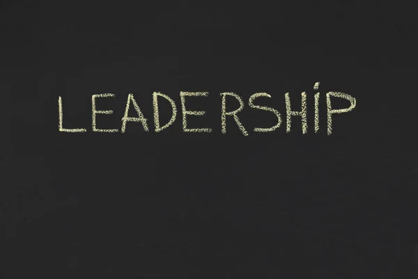 Leadership word handwriting on blackboard, copy space