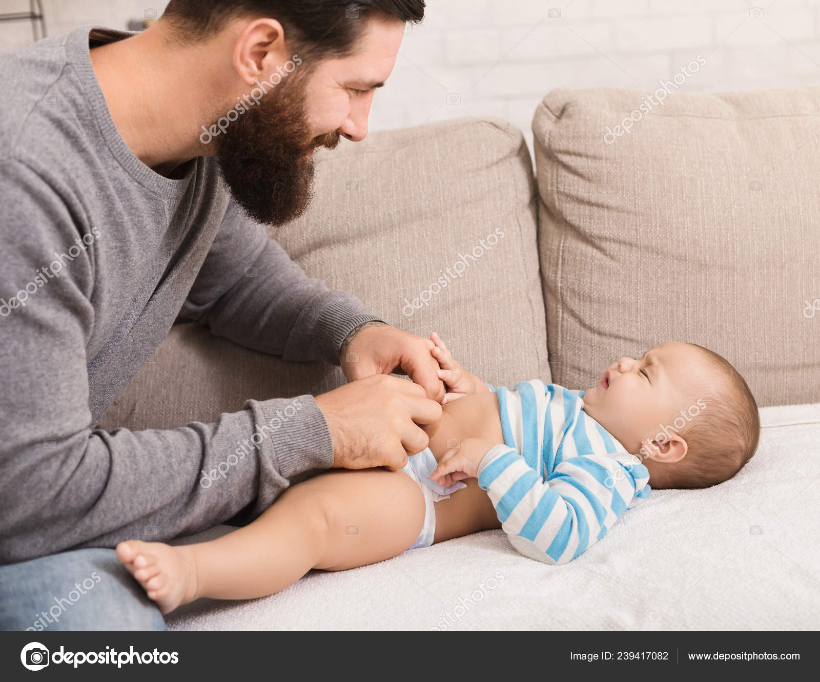 dad changing diaper baby laughing vansoffthewallhat