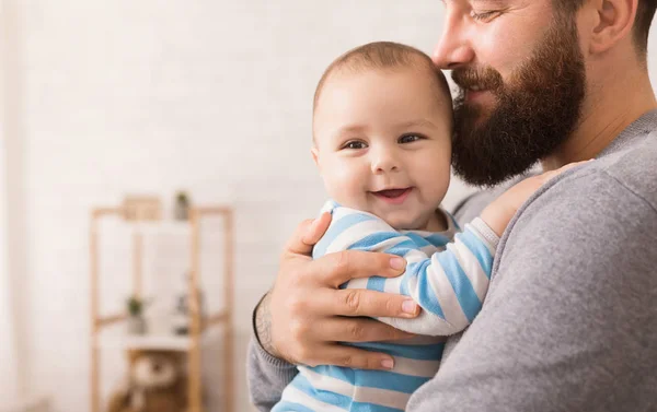 Loving father embracing his cute baby son — Stock Photo, Image