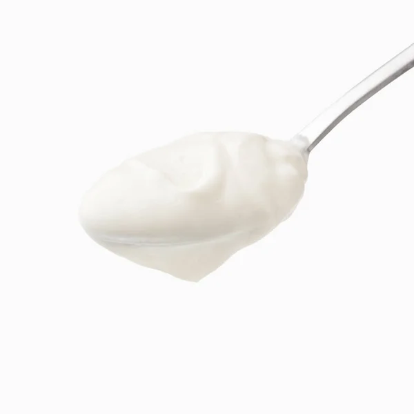Sour cream in spoon isolated — Stock Photo, Image