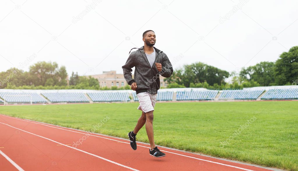 Black runner man at stadium