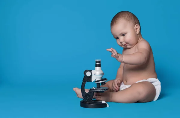 Adorable baby boy with microscope, copy space — Stock Photo, Image