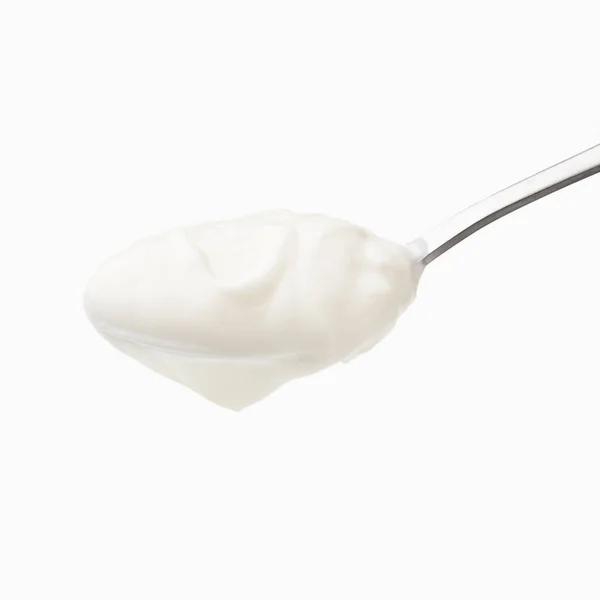 Yogurt in spoon isolated — Stock Photo, Image