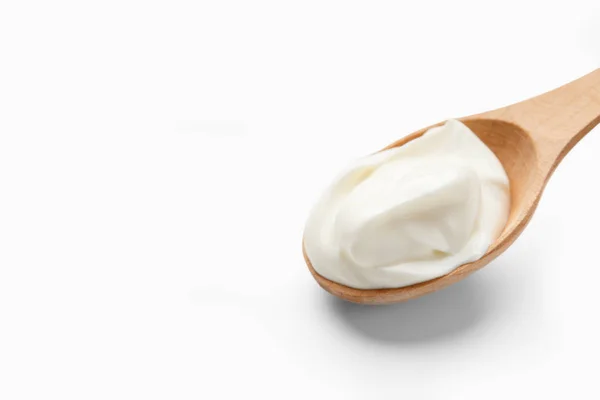 Spoon with yogurt, copy space — Stock Photo, Image